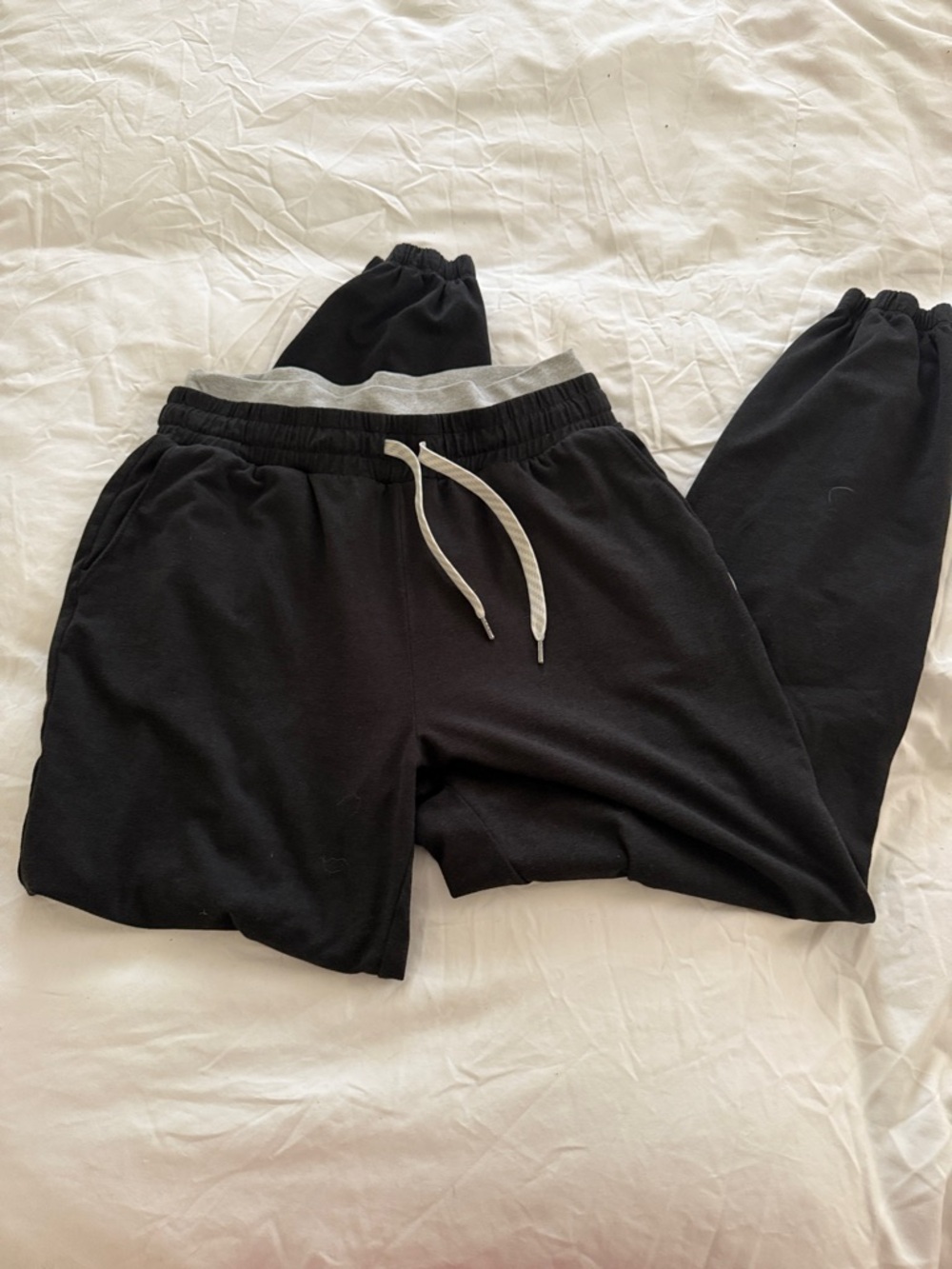 Vuori warmup Jogger Pants with Gray Waistband and White Drawstring.